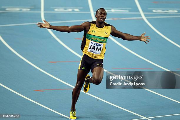 Usain Bolt of Jamaica celebrates victory and a new world record in the men's 4x100 metres relay final during day nine of 13th IAAF World Athletics...