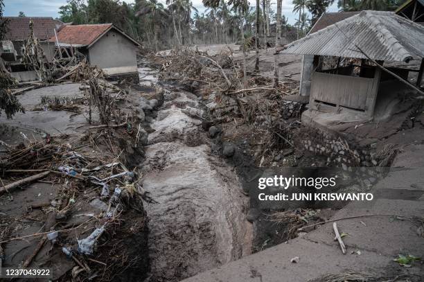 Damaged homes are seen at Sumber Wuluh village in Lumajang on December 6 following a volcanic eruption from Mount Semeru that killed a least fourteen...