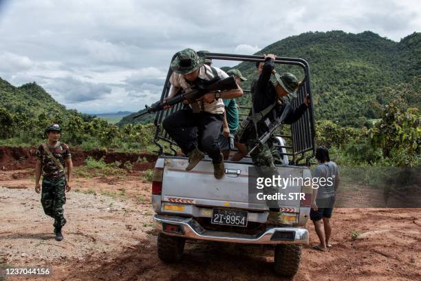This photo taken on October 19, 2021 shows members of the Karenni Nationalities Defence Force and Kareni Army at a checkpoint near Demoso, in...