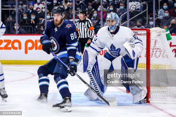 Pierre-Luc Dubois of the Winnipeg Jets and goaltender Joseph Woll of the Toronto Maple Leafs keep an eye on the play during third period action at...