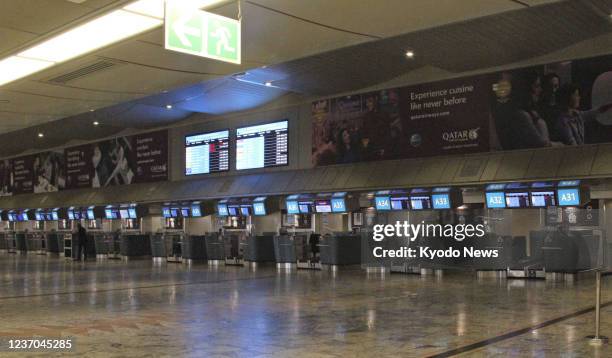The international departure area of OR Tambo International Airport in Johannesburg, South Africa, is deserted on Dec. 4 amid concern over the new...