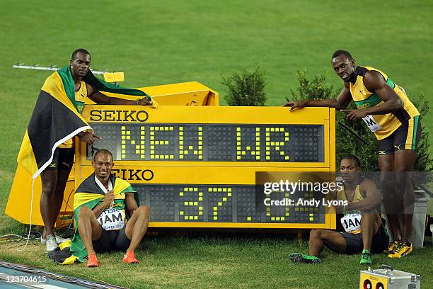 Nesta Carter, Michael Frater, Yohan Blake and Usain Bolt of Jamaica celebrate victory and a new world record in the men's 4x100 metres relay final...