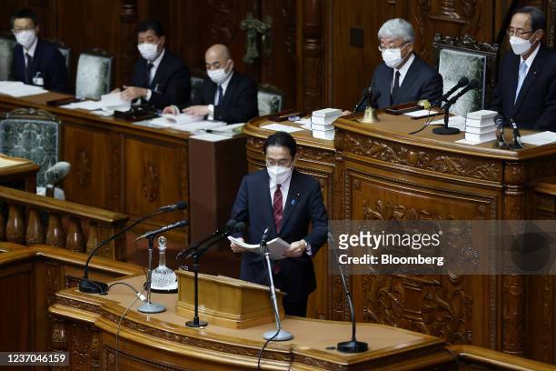 Fumio Kishida, Japan's prime minister, approaches the podium to deliver a policy speech during an extraordinary session at the lower house of...