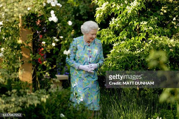 Queen Elizabeth II visits a garden at the Chelsea Flower Show in London, on May 24, 2010. The show, which has 600 exhibitors, opens to the public on...