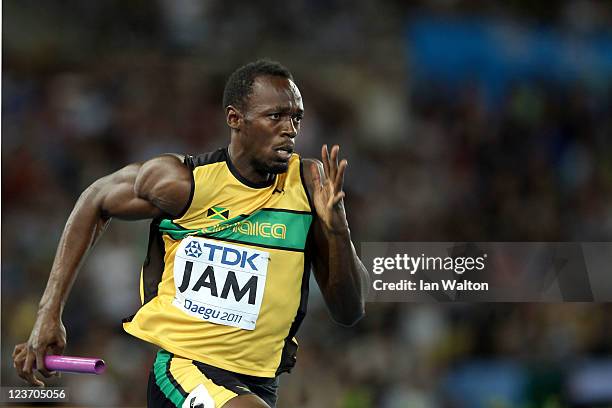 Usain Bolt of Jamaica sprints to victory and a new world record in the men's 4x100 metres relay final during day nine of 13th IAAF World Athletics...