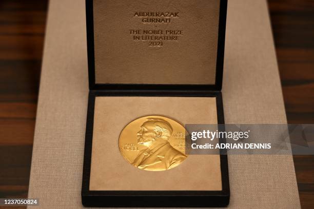 The Nobel medal of British novelist Abdulrazak Gurnah sits on a table at the Swedish Ambassador's residence in London on December 6, 2021. - Gurnah...