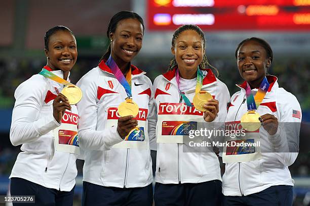 Carmelita Jeter, Marshevet Myers, Allyson Felix and Bianca Knight of the USA pose with their gold medals during the medal ceremony for the women's...