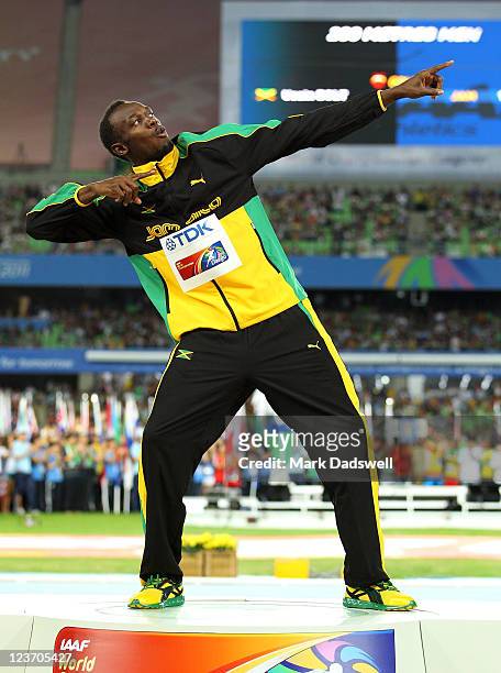 Usain Bolt of Jamaica poses with his gold medal during the medal ceremony for the men's 200 metres final during day nine of 13th IAAF World Athletics...