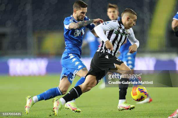 Petar Stojanovic of Empoli FC battles for the ball with Lazaro Gerard Deulofeu of Udinese Calcio during the Serie A match between Empoli FC and...