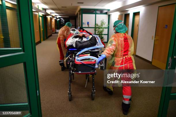 Doctor and HEMS TC of ´Christoph Nuremberg` intensive care helicopter of DRF Luftrettung transfer a COVID-19 patient from one COVID-19 intensive care...