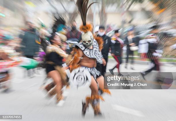 Folklorico dancers take part in the 90th annual Virgen de Guadalupe procession on Cesar Chavez Avenue in East Los Angeles on Sunday, Dec. 5, 2021....