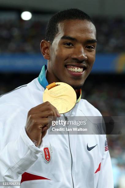 Christian Taylor of the USA poses with his gold medal during the medal ceremony for the men's triple jump final during day nine of 13th IAAF World...