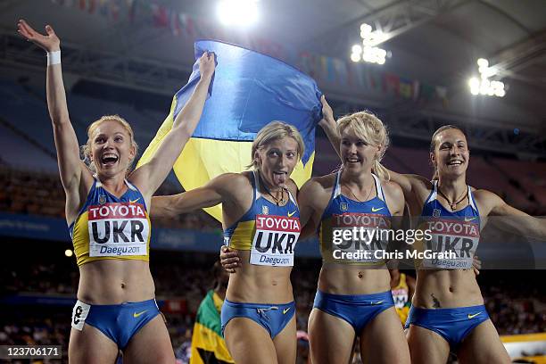 Hrystyna Stuy, Mariya Ryemyen, Nataliya Pohrebnyak and Olesya Povh of Ukraine celebrate their bronze medal in the women's 4x100 metres relay final...