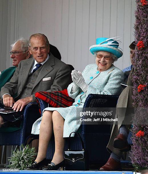 Queen Elizabeth II and Prince Philip, Duke of Edinburgh attend the Braemar Highland Games at The Princess Royal and Duke of Fife Memorial Park on...