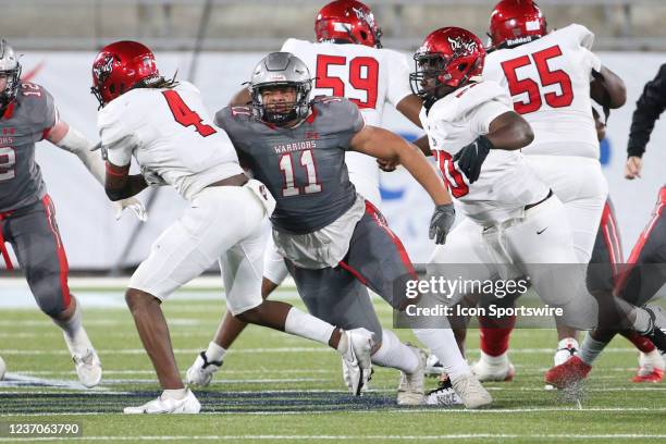 Thompson Warriors defensive end Peter Woods tackles Central-Phenix City Red Devils running back Jaimel Johnson during the Alabama High School 7A...