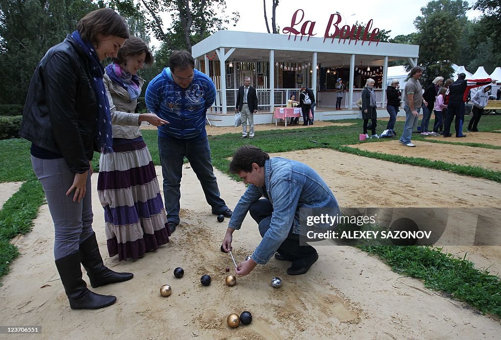 Moscovites try to play traditional French game La Petanque at the