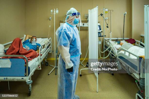 Doctor with his protection equipment suit attends the patients of COVID-19 in the intensive cares units of the Kiev City Clinical Hospital 7, Ukraine.
