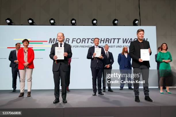 Olaf Scholz of the German Social Democrats , Robert Habeck , co-leader of the German Greens Party, and Christian Lindner , leader of the German Free...