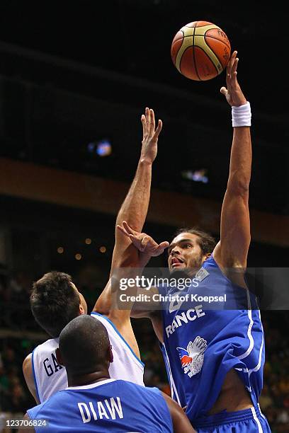 Danilo Gallniari of Italy defends against Joakim Noah of France during the EuroBasket 2011 first round group B match between Italy and France at...