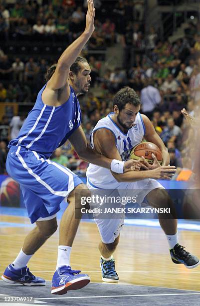 France's Joakim Noah vies with Italy's Marco Belinelli during the first round, Group B, basketball match in Siauliai on September 4 on the fourth day...