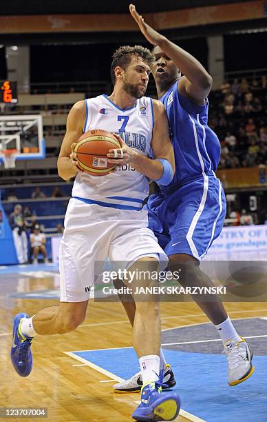 France's Kevin Seraphin vies with Italy's Andrea Bargnani during the first round, Group B, basketball match in Siauliai on September 4 on the fourth...