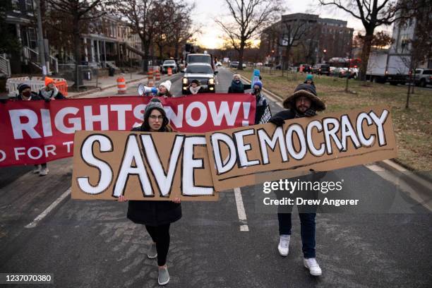 Activists rally for voting rights and DC statehood as they block traffic on Pennsylvania Avenue SE on December 7, 2021 in Washington, DC. ShutDownDC...