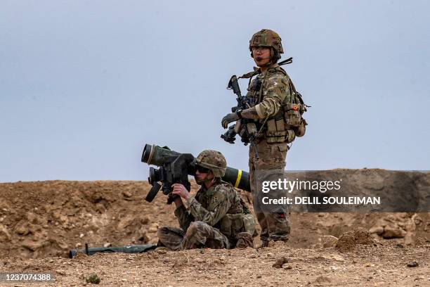 Soldier prepares to fire a javelin surface-to-air missile launcher during a joint military exercise between the Syrian Democratic Forces and the...