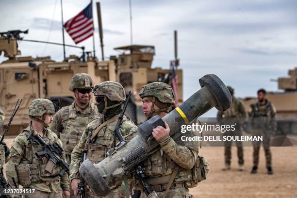 Soldier carries a javelin surface-to-air missile launcher during a joint military exercise between the Syrian Democratic Forces and the US-led...