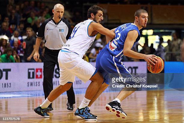 Marco Belinelli of Italy defends against Nando de Colo of France the EuroBasket 2011 first round group B match between Italy and France at Siauliai...