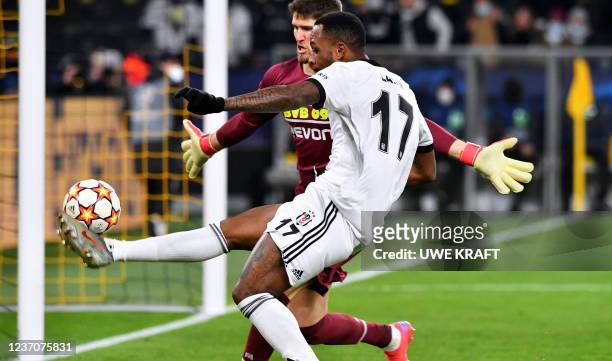 Besiktas' Canadian forward Cyle Larin and Dortmund's Swiss goalkeeper Gregor Kobel vie for the ball during the UEFA Champions League Group C football...