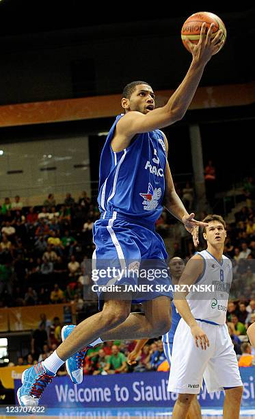 France's Nicolas Batum vies with Italys Danilo Gallinari during the first round group B qualifying match between France and Italy in Siauliai on...