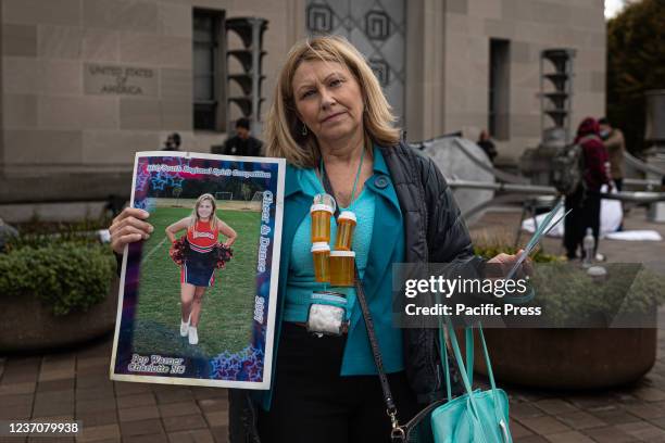 Susan Stevens carries her daughter Toria's ashes around her neck since she died of an opioid overdose in 2018. People from across the United States,...