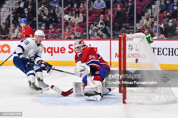 Ondrej Palat of the Tampa Bay Lightning gets the puck past goaltender Jake Allen of the Montreal Canadiens and scores the game-winning goal during...