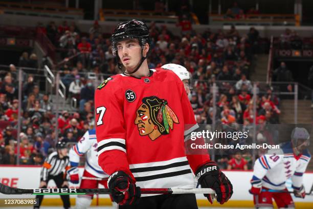 Kirby Dach of the Chicago Blackhawks looks on in the second period against the New York Rangers at United Center on December 07, 2021 in Chicago,...