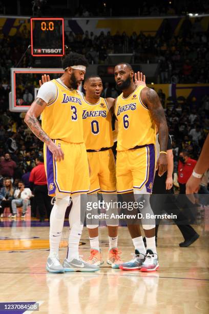 Anthony Davis of the Los Angeles Lakers, Russell Westbrook of the Los Angeles Lakers and LeBron James of the Los Angeles Lakers look on during the...
