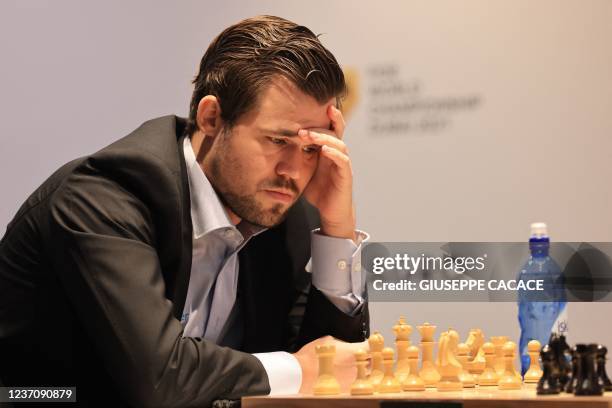 Norway's grandmaster Magnus Carlsen competes with Russia's grandmaster Ian Nepomniachtchi during game 10 in the FIDE World Chess Championship Dubai...