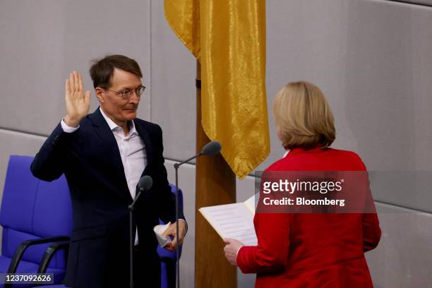 Karl Lauterbach, Germany's health minister, left, swears an oath after being elected at the Bundestag in Berlin, Germany, on Wednesday, Dec. 8, 2021....