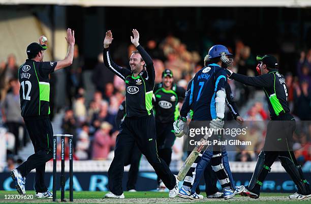 Chris Schofield of Surrey celebrates with his team-mates after securing a place in the Clydesdale Bank 40 Final for Surrey after taking the final...