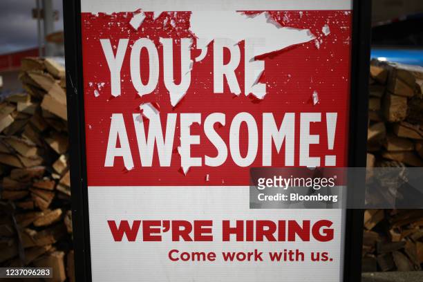 Now Hiring' sign outside a outside a Casey's General Stores Inc. Gas station in Seymour, Indiana, U.S., on Monday, Dec. 6, 2021. U.S. Job openings...