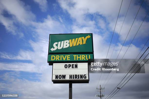 Now Hiring' sign outside a Subway restaurant in Seymour, Indiana, U.S., on Monday, Dec. 6, 2021. U.S. Job openings jumped in October to the...