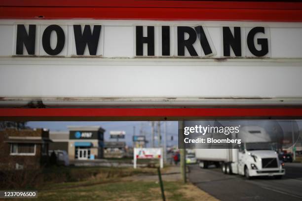 Now Hiring' sign outside a Marathon Petroleum Co. Speedway gas station in Seymour, Indiana, U.S., on Monday, Dec. 6, 2021. U.S. Job openings jumped...