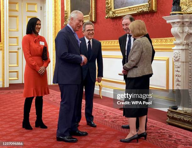 Prince Charles, Prince of Wales is introduced to guests by Lord Browne chairman of the Queen Elizabeth Prize for Engineering Foundation and its CEO...