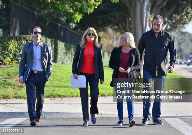 Irvine, CA Blizzard Entertainment employee Christine , and her husband, Eric, right, walk with her attorneys Lisa Bloom and Avi Goldstein, before a...