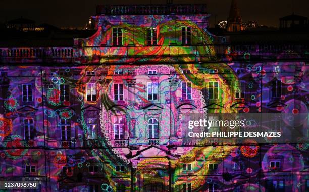 Photograph taken on December 8, 2021 shows the modern art museum illuminated on the "Les Terreaux" square during the Festival of Lights , in Lyon...