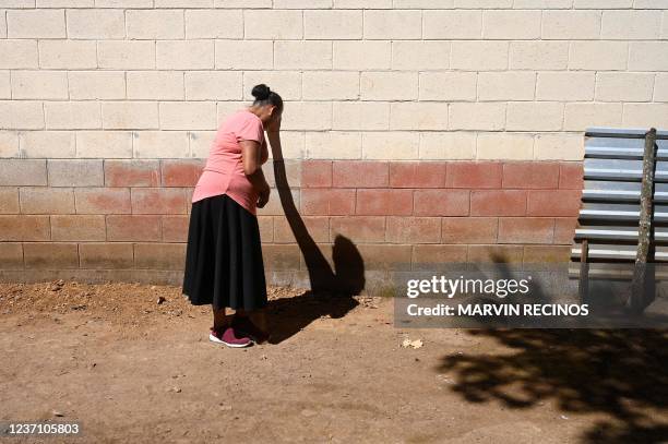Miriam Núñez de Márquez points out the place where 15 skeletons of her relatives killed during the 1981 El Mozote massacre were found, in the village...