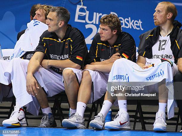 Dirk Nowitzki, Sven Schultze, Lucca Staiger and Chris Kaman of Germany look dejected during the EuroBasket 2011 first round group B match between...