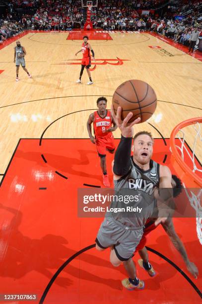 Blake Griffin of the Brooklyn Nets dunks the ball during the game against the Houston Rockets on December 8, 2021 at the Toyota Center in Houston,...