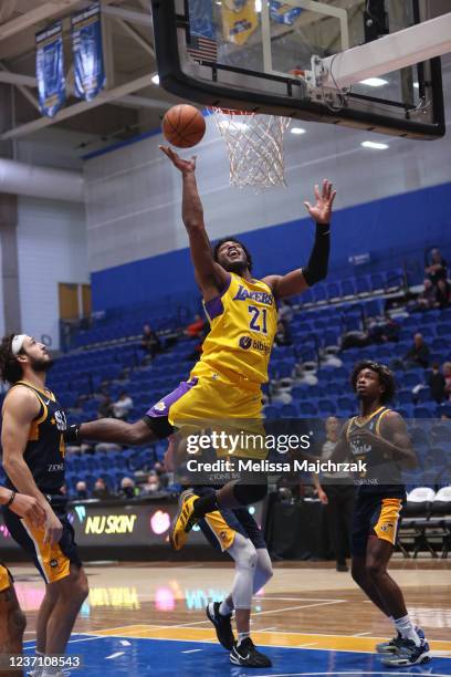Cameron Oliver of the South Bay Lakers splits the defense and goes up for the shot against J.J. Avila and Brendan Bailey of the Salt Lake City Stars...