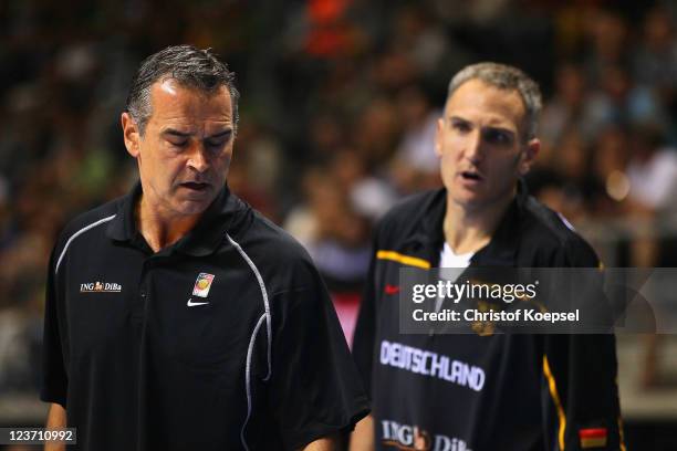 Head coach Dirk Bauermann and Sven Schultze of Germany look dejected during the EuroBasket 2011 first round group B match between Germany and Serbia...