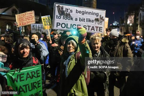 Protesters hold placards expressing their opinions during the demonstration. Protesters initially gathered to protest against the Police, Crime,...